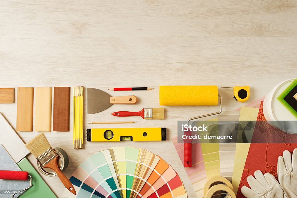 Decorator's work table with tools Decorating and DIY hobby tools and color swatches with copy space on top, top view Home Improvement Stock Photo Decorator's work table with tools Decorating and DIY hobby tools and color swatches with copy space on top, top view Home Improvement Stock Photo