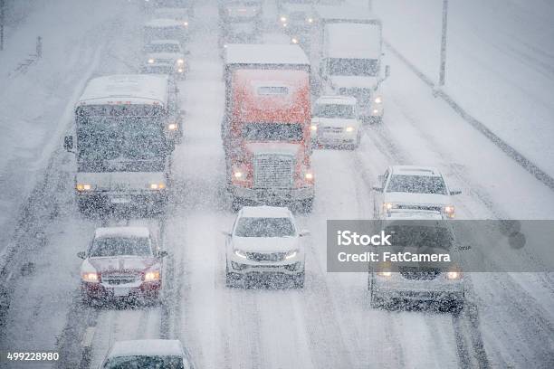 Driving In A Snow Storm Stock Photo - Download Image Now - Snow, Blizzard, Traffic
