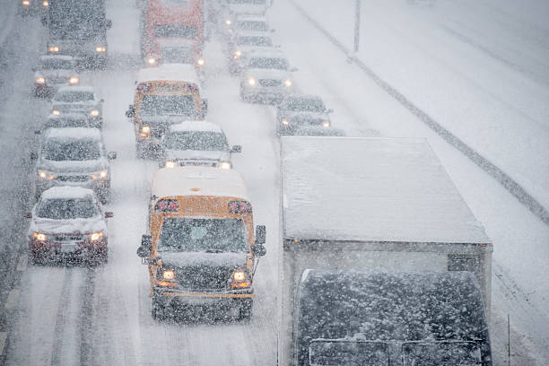 istock Vehicles Going Slowly on the Road in the Storm 499229168