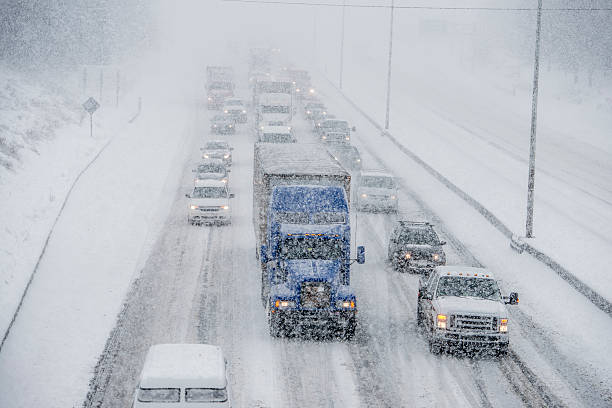 istock Line of Vehicles Trudging Through the Storm 499229556