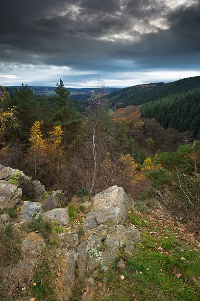A beautiful rock formation (Rocher de Falize) in the Belgium Ardennes during autumn.