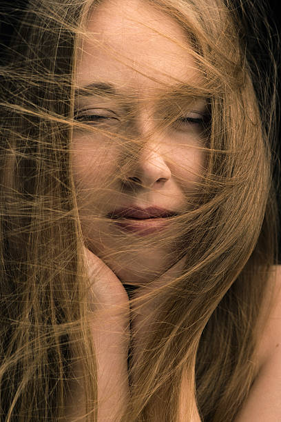 istock woman with flying long hair 499230936