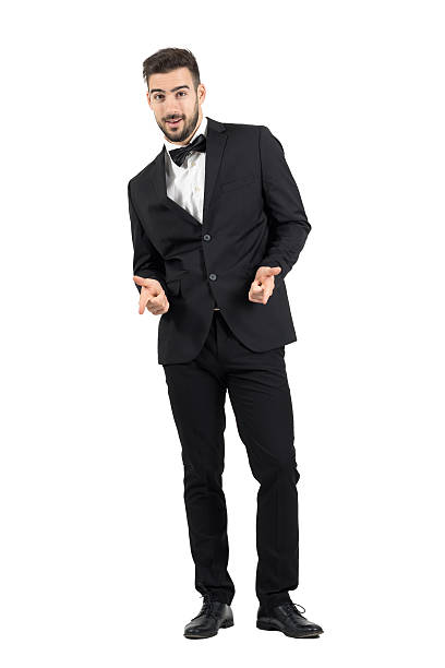 istock Happy laughing young luxurious man in tuxedo pointing at camera 499232088