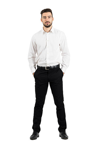 Confident elegant business man with hands in pockets Confident elegant business man with hands in pockets looking at camera. Full body length portrait isolated over white studio background white people stock pictures, royalty-free photos & images