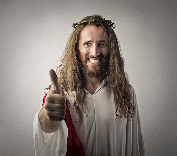 Happy Jesus Man dressed as Jesus Christ showing thumbs up irony stock pictures, royalty-free photos & images