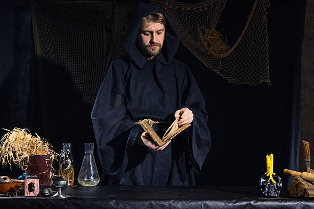 istock Portrait of a crazy medieval scientist working in his laboratory. 499234286