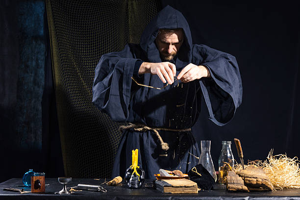 istock Portrait of a crazy medieval scientist working in his laboratory. 499234488