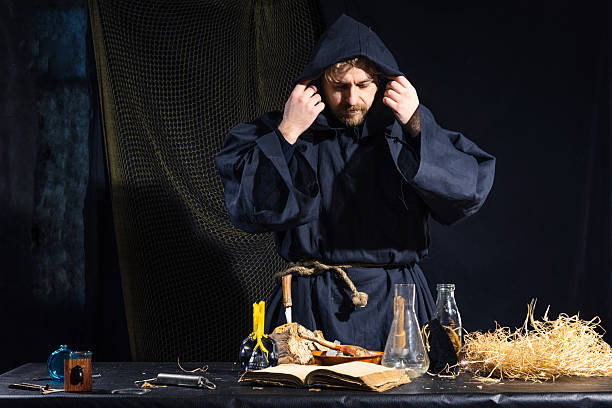 istock Portrait of a crazy medieval scientist working in his laboratory. 499235074