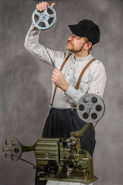 istock Cameraman with  a film projection 499235628