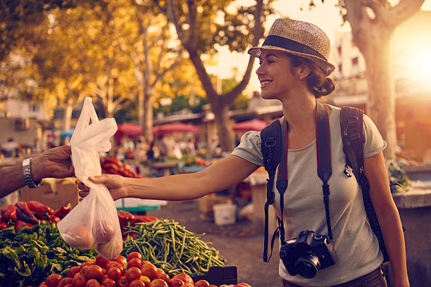 istock She couldn't walk by without buying some local goodies 499235764