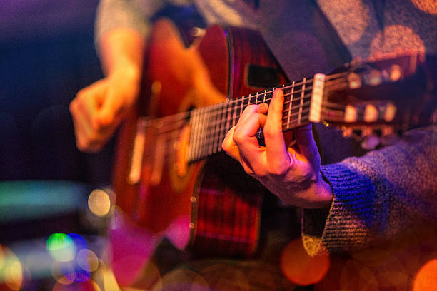 istock Man playing acoustic guitar 499237142