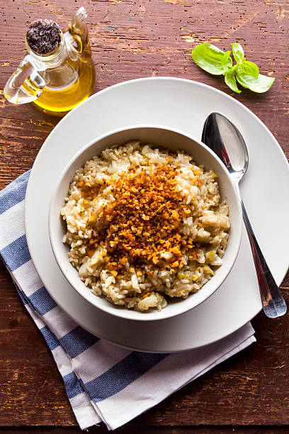 istock Italian risotto on a wooden table 499237258
