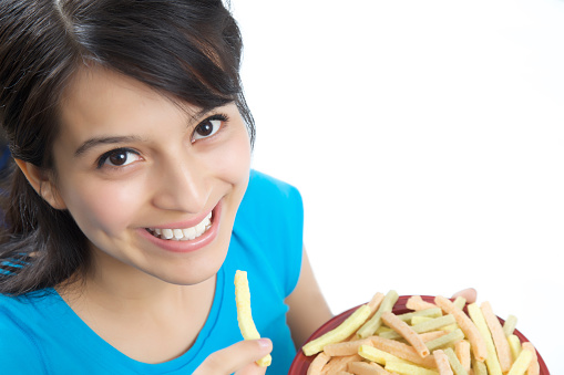 woman eating veggie fries