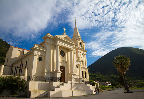 Church of San Lorenzo in Malfa on the island of Salina, Aeolian Islands, Italy backdropped by an extinct volcano.