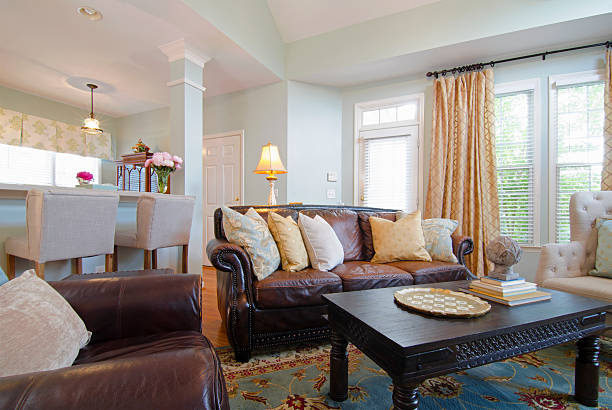 Panorama of small and stylish studio apartment with big windows and living room, kitchen and dining area in one room