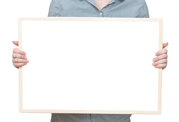 istock blank bulletin board in female hand 499244573