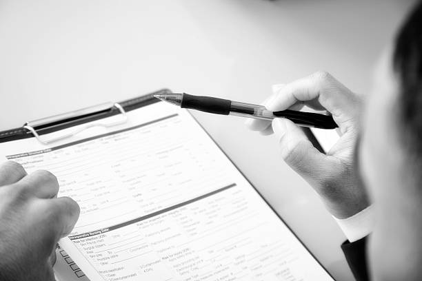 istock African descent business man completes employment application. 499244627