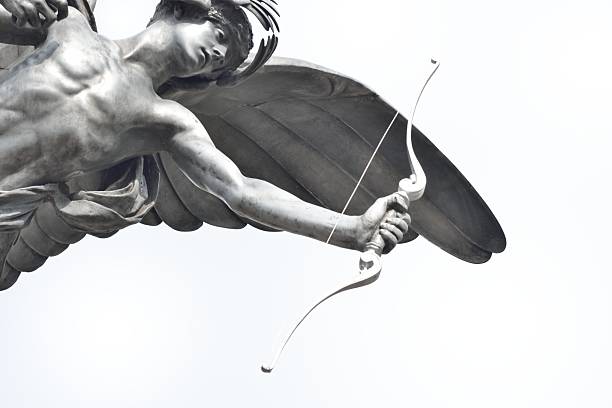 Close up of Eros Staue Eros Statue in close up archery bow stock pictures, royalty-free photos & images