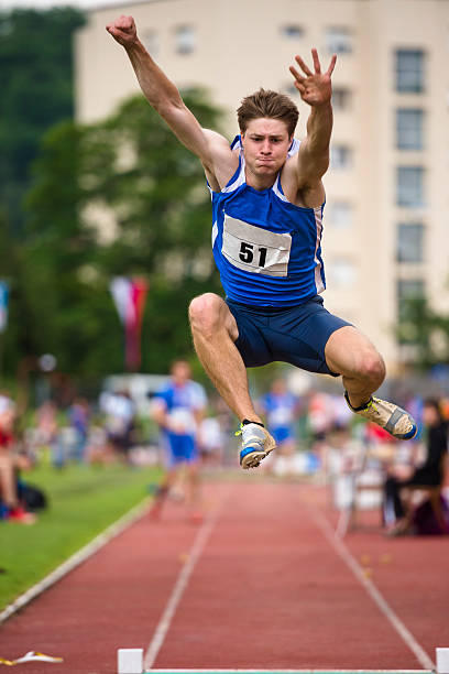 istock Front View of Young Athlete Long Jump 499245881