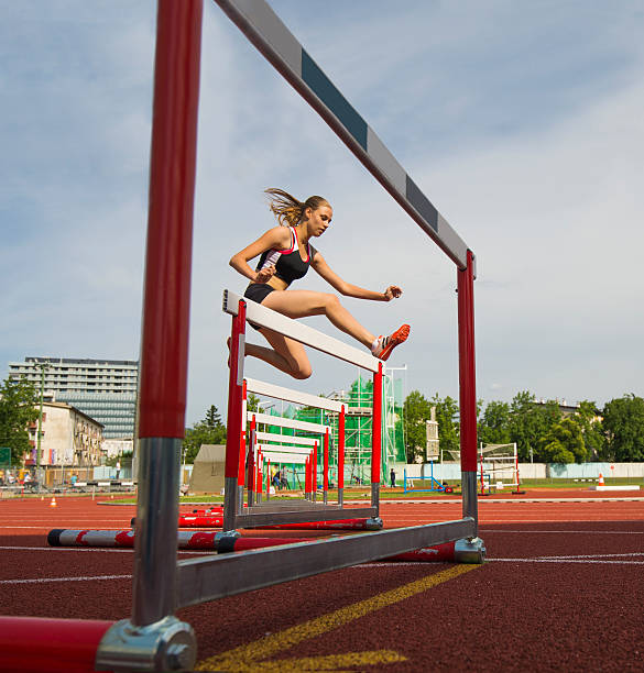 istock Young Women at 400m Hurdle Race 499245885