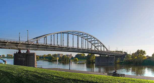 The old bridge over the river Rhine of Arnhem. The old bridge of Arnhem, later named after John Frost because of the heroic battle during Market Garden Airborne Operation. arnhem photos stock pictures, royalty-free photos & images