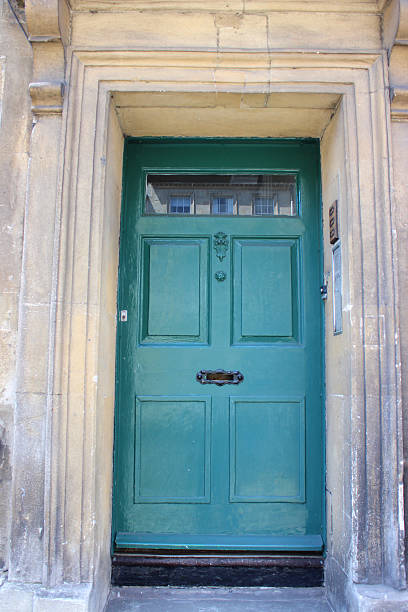 istock Image of turquoise front door with Georgian surround, Bath stone 499248327