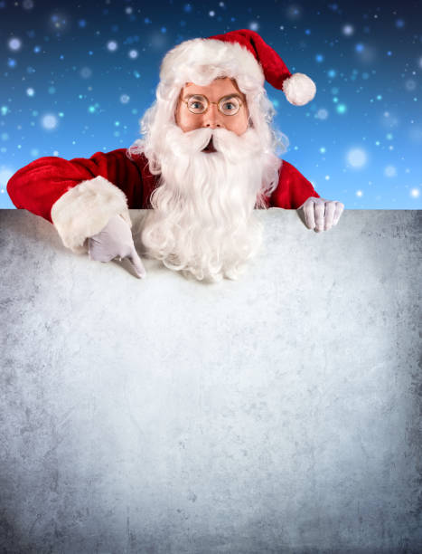 istock Santa Claus Showing Empty Signboard With Finger 499253630