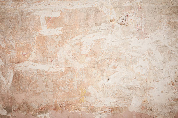 istock Old color beige mottled wall background 499256462