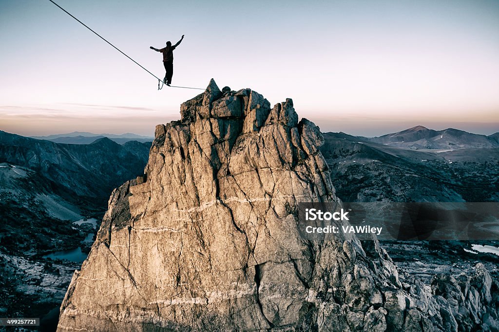 bold Slackline high in the mountains Balance Stock Photo