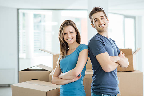 istock Loving couple posing in their new house 499258668