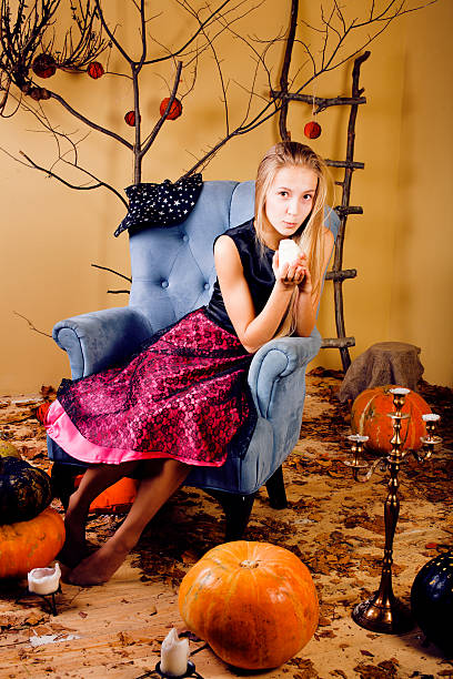 blond cute girl in halloween interior