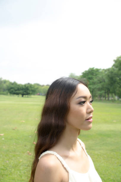 istock Young woman relaxing in garden, soft filter effect 499259033