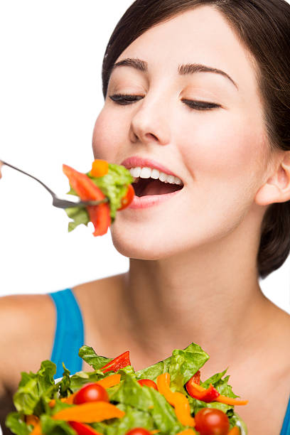 istock Young hispanic woman eating salad 499259057