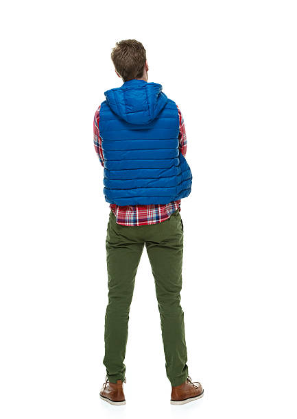 istock Rear view of young man standing 499260271