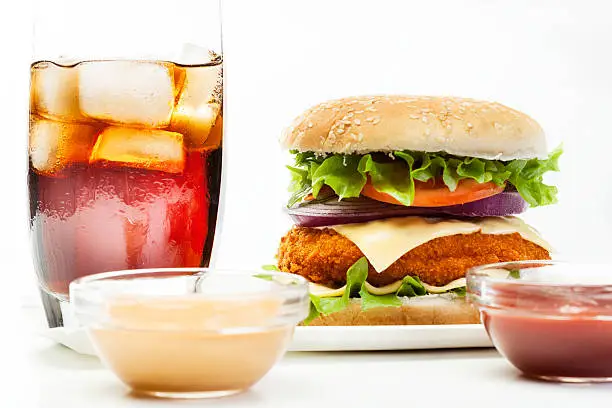 Chicken burger and glass of cola with ice