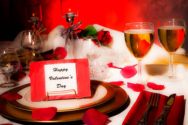 istock Valentine's Day dinner. Romantic table place setting. Card on plate. 499262198