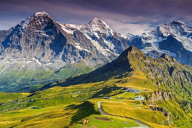 Stunning alpine panorama with Jungfrau,Monch,Eiger North face and Mannlichen cable car station,Grindelwald,Bernese Oberland,Switzerland,Europe