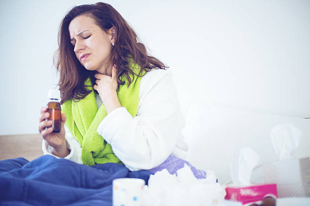 istock Woman with sore throat 499263832