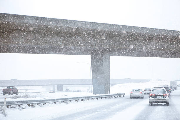 istock Traffic Moving Through Underpass In A Winter Storm 499263942