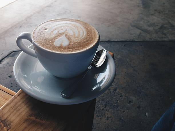 Latte on the Arm of a Wooden chair