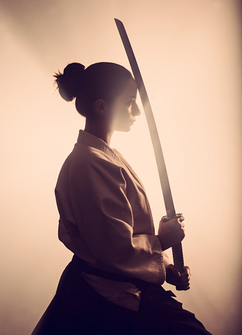 Young woman with samurai sword