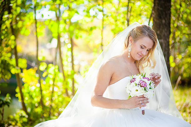 istock blonde bride and the bridal bouquet 499267724
