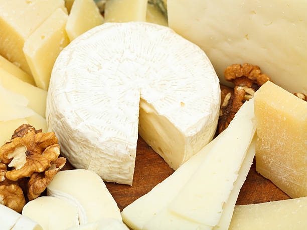 istock various cheeses on wooden plate 499274069