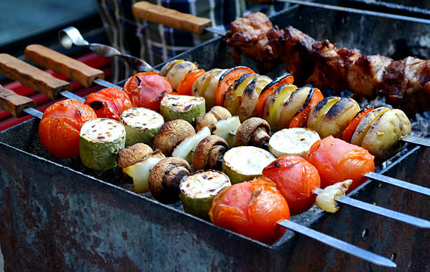istock Grilled vegetables - tomatoes, mushrooms, onions and squash 499276375