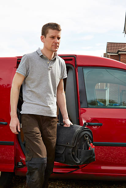 istock Tradesman walking away from van 499276469