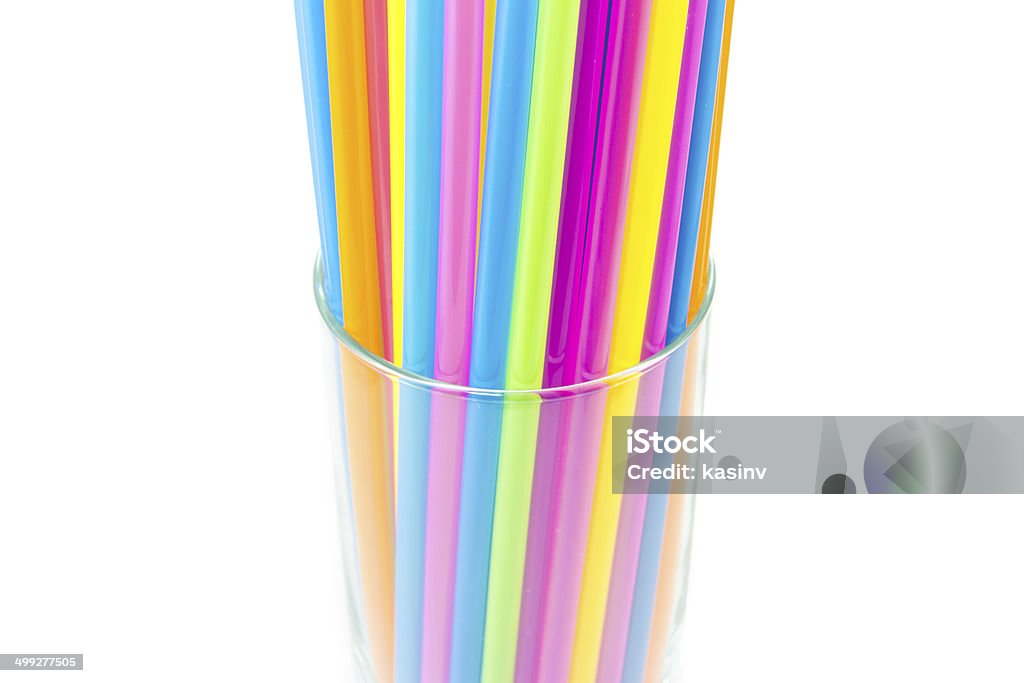 Drinking straws in glass isolated on white background Colorful drinking straws in glass isolated on white background Abstract Stock Photo