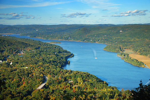 Autumn Mountain peak view panorama with colorful foliage in forest and Hudson River.