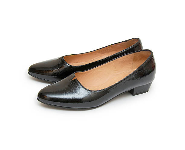 istock women shoes on white background 499279218