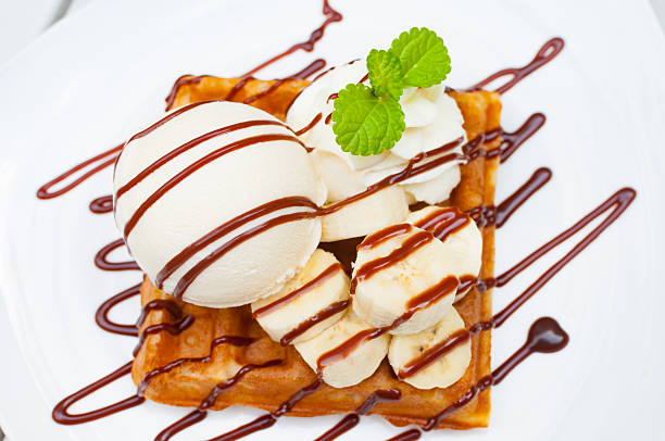 istock Close up Ice cream waffle banana with chocolate sauce 499279324