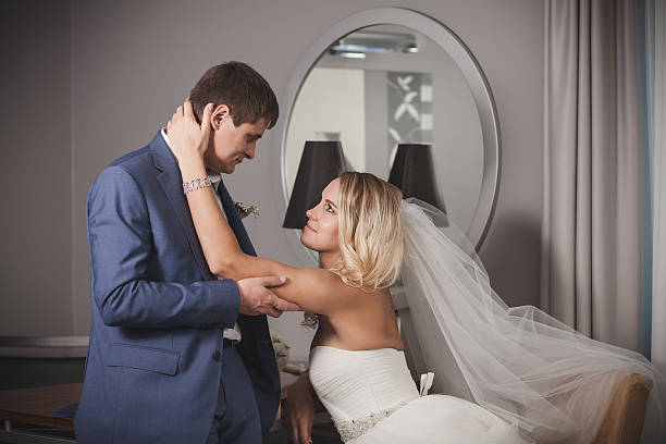 istock bride and groom family portrait 499280146